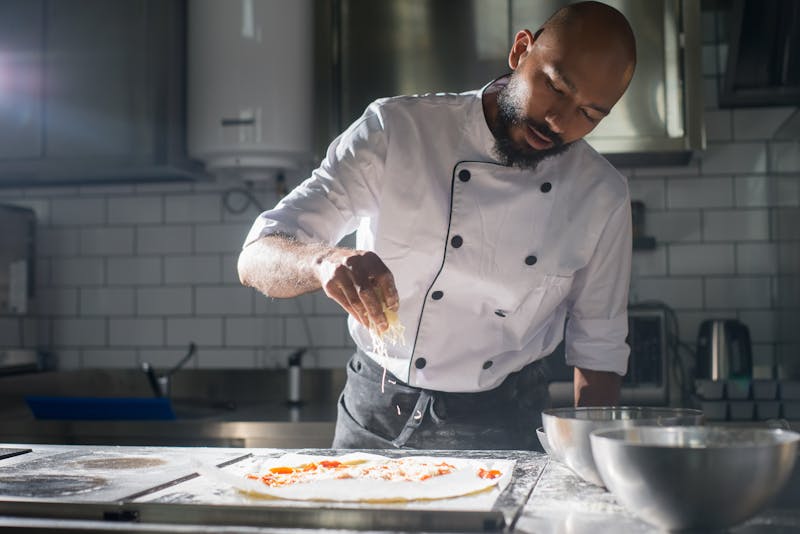 Our team preparing fresh dough in the kitchen
